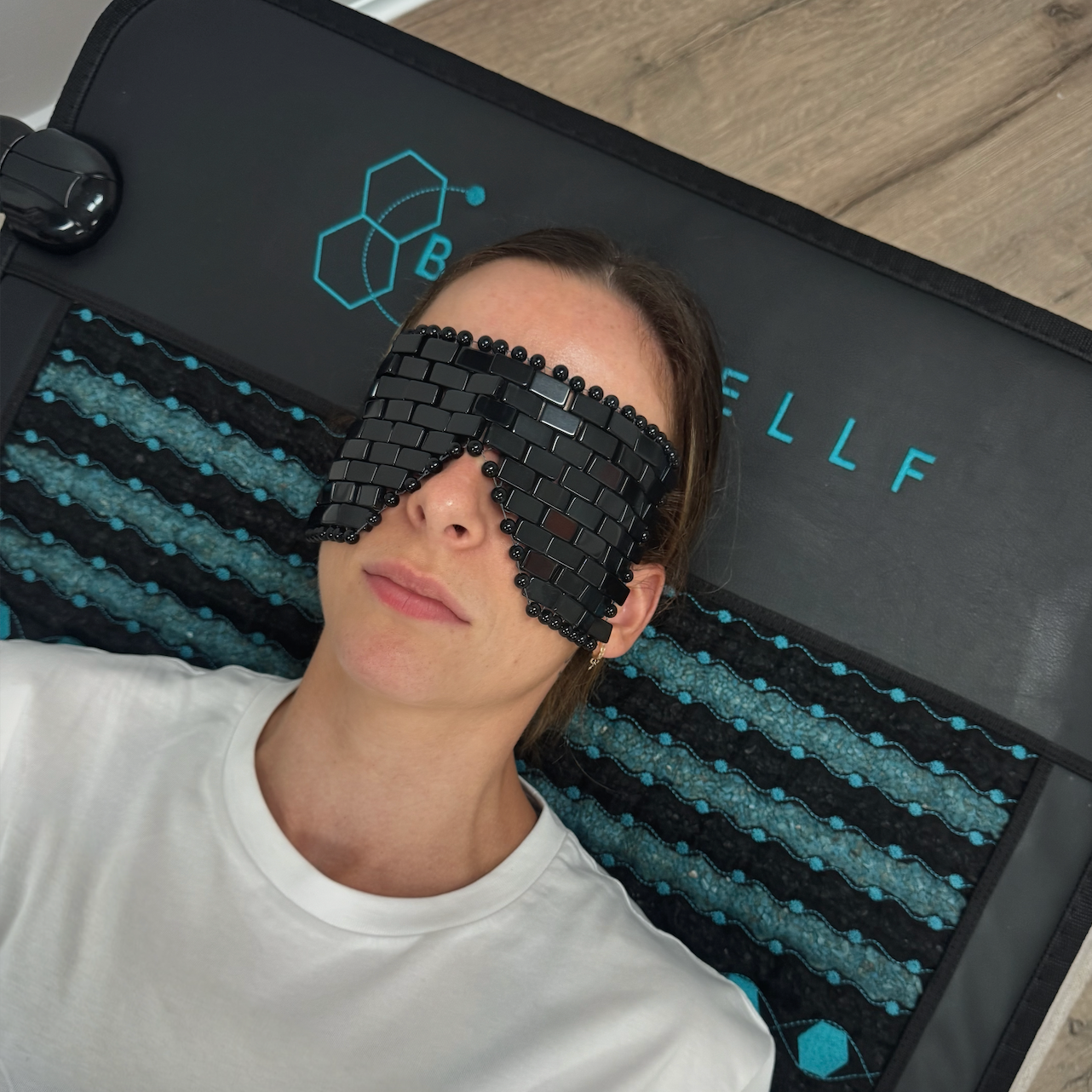 India wearing black obsidian crystal eye mask