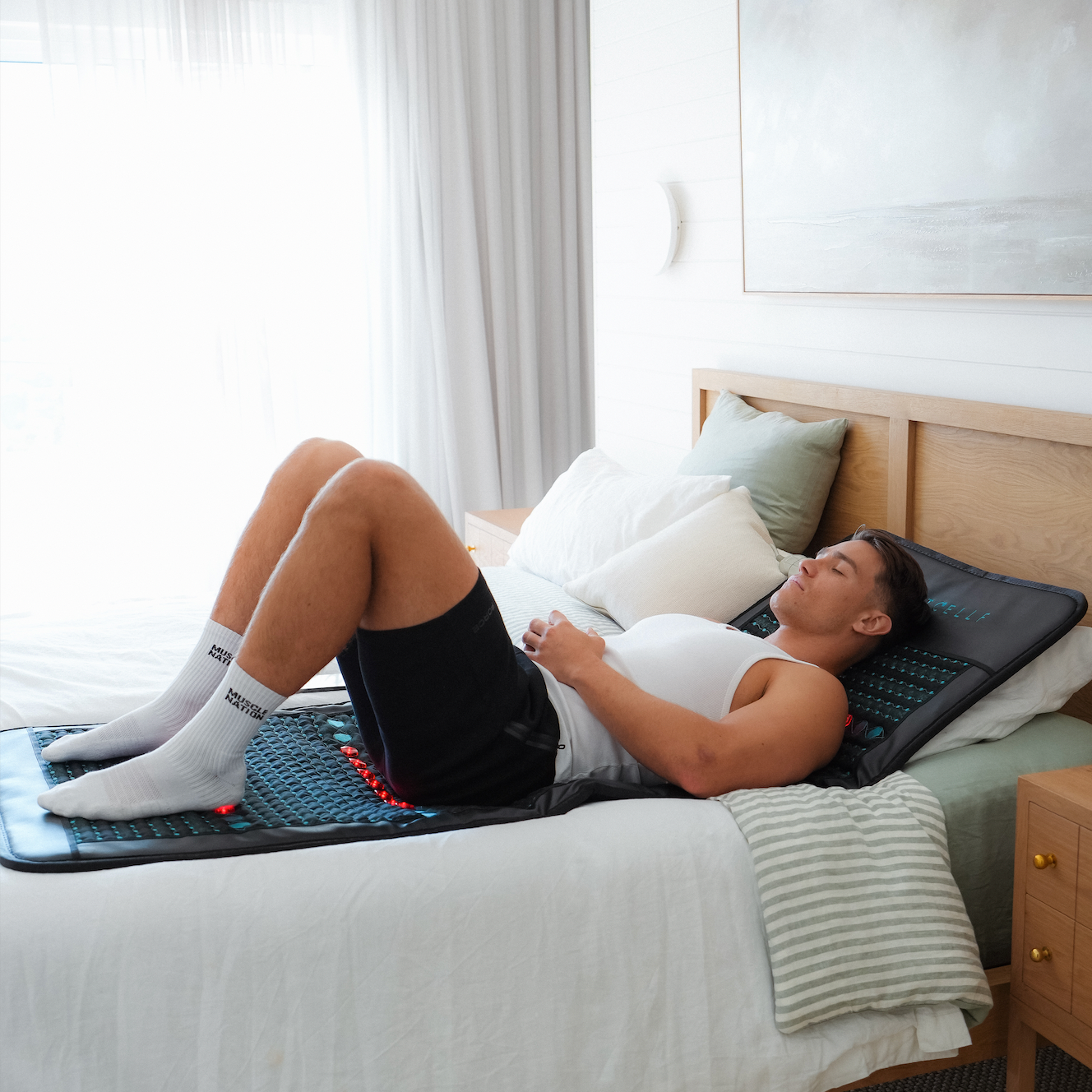 Brett using the mat on bed