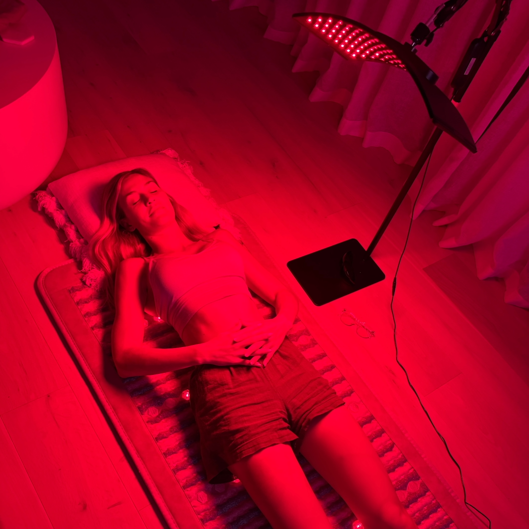 Candice under lamp on PEMF mat